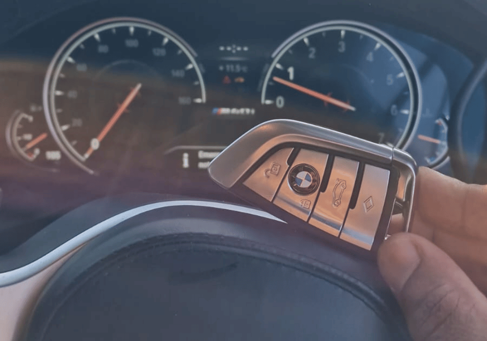 BMW car key on the car steering wheel